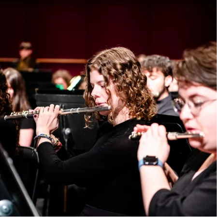 Students playing a transverse flute 
