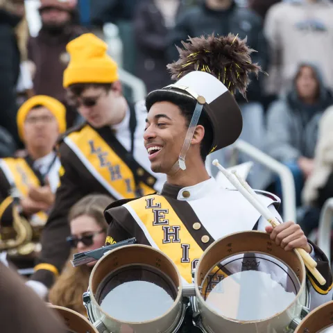 Lehigh band member holding the drums.