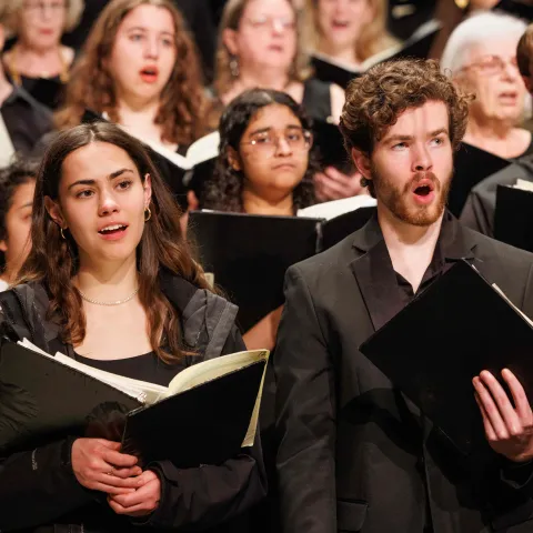 Choral members singing.