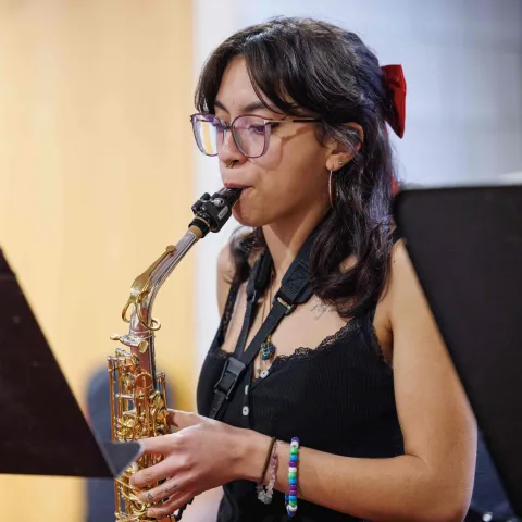 Jazz student playing the saxophone.
