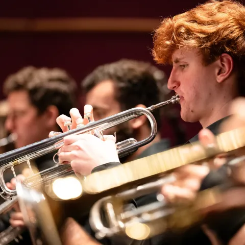Lehigh Philharmonic Orchestra members playing the trumpet.