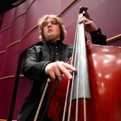 A member of Lehigh Philharmonic Orchestra playing the cello. 