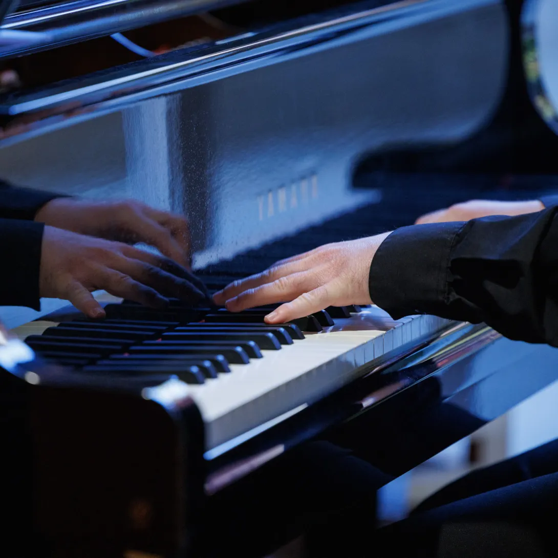 Playing the piano.