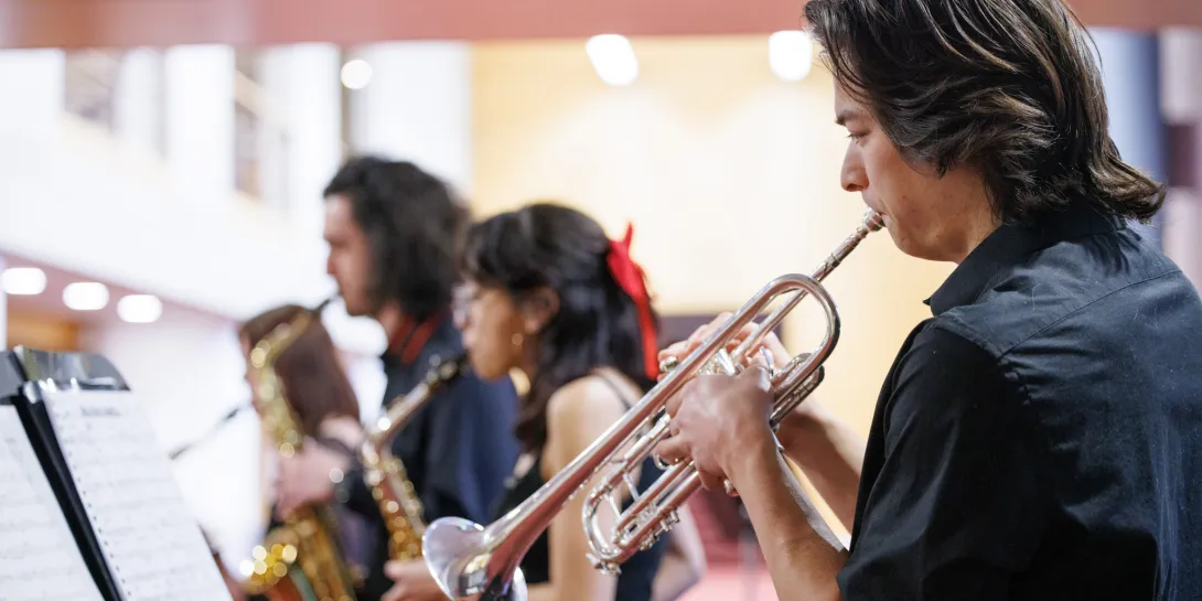 Three members of a Jazz ensemble playing in Zoellner Arts Center.