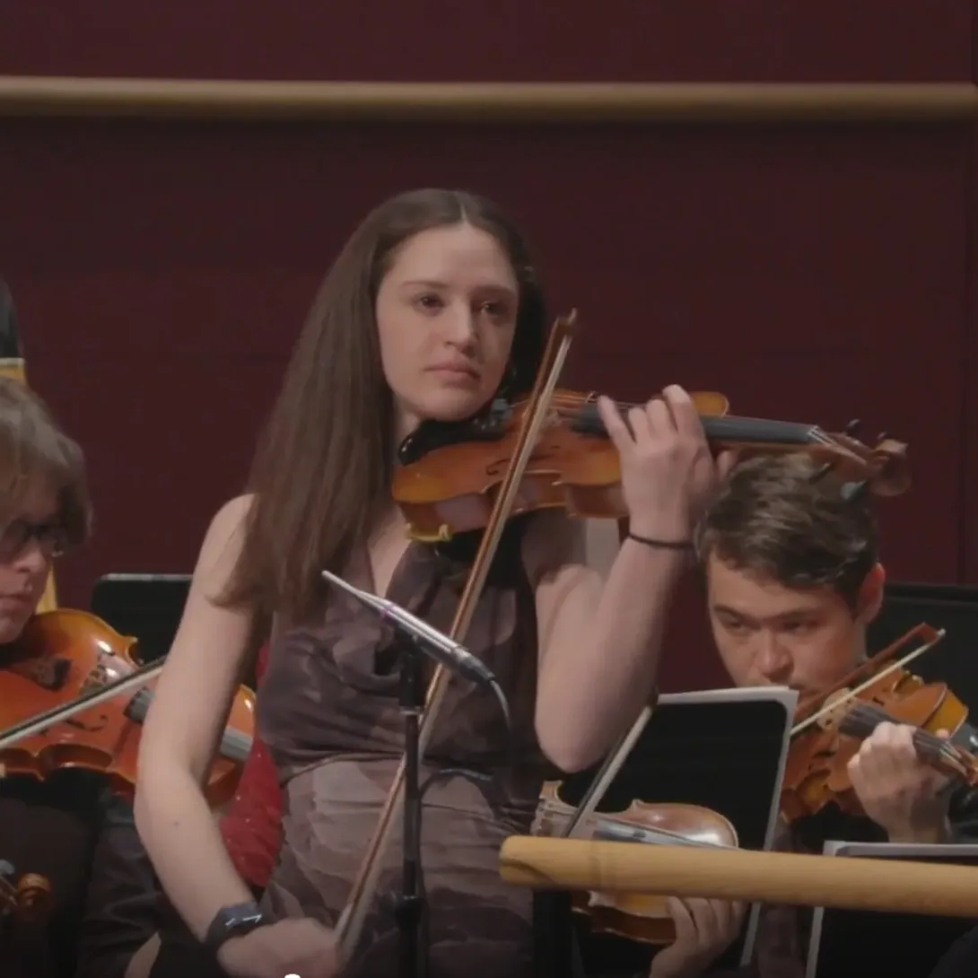 Allison Connuck performing with her violin.