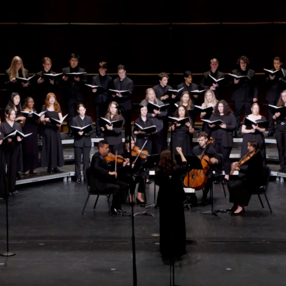 Members of Lehigh's Choir, Dolce, and Glee Club performing together on stage.