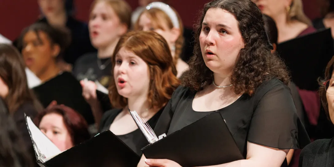 Choir members singing.