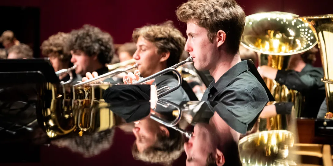 Students playing the trumpet. 