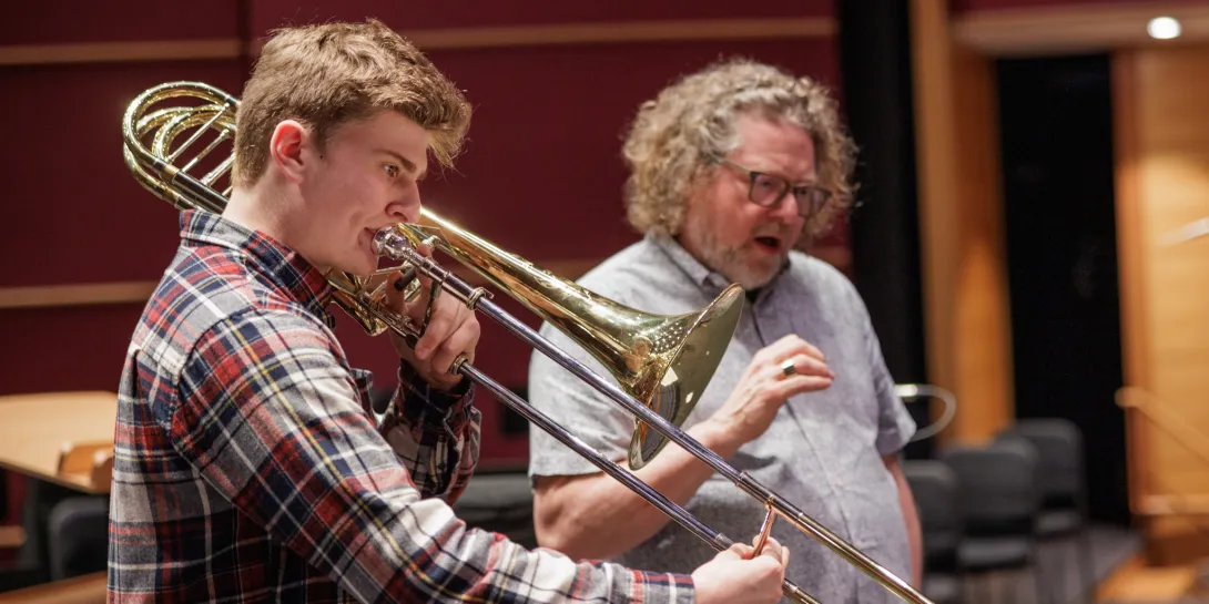 Shane Duffy practicing the saxophone with professor Darin Lewis.
