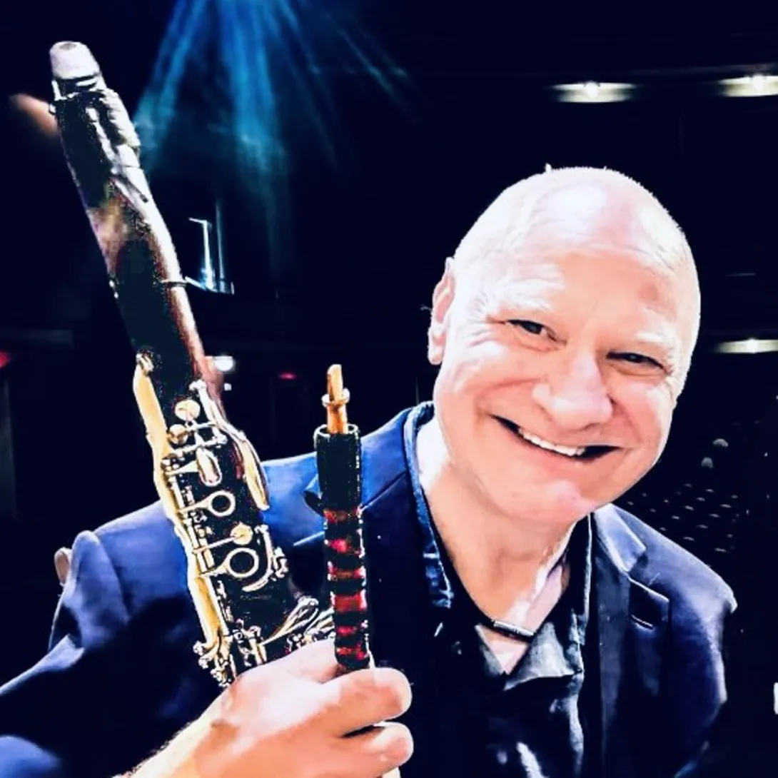 Thomas Piercy holding a clarinet.