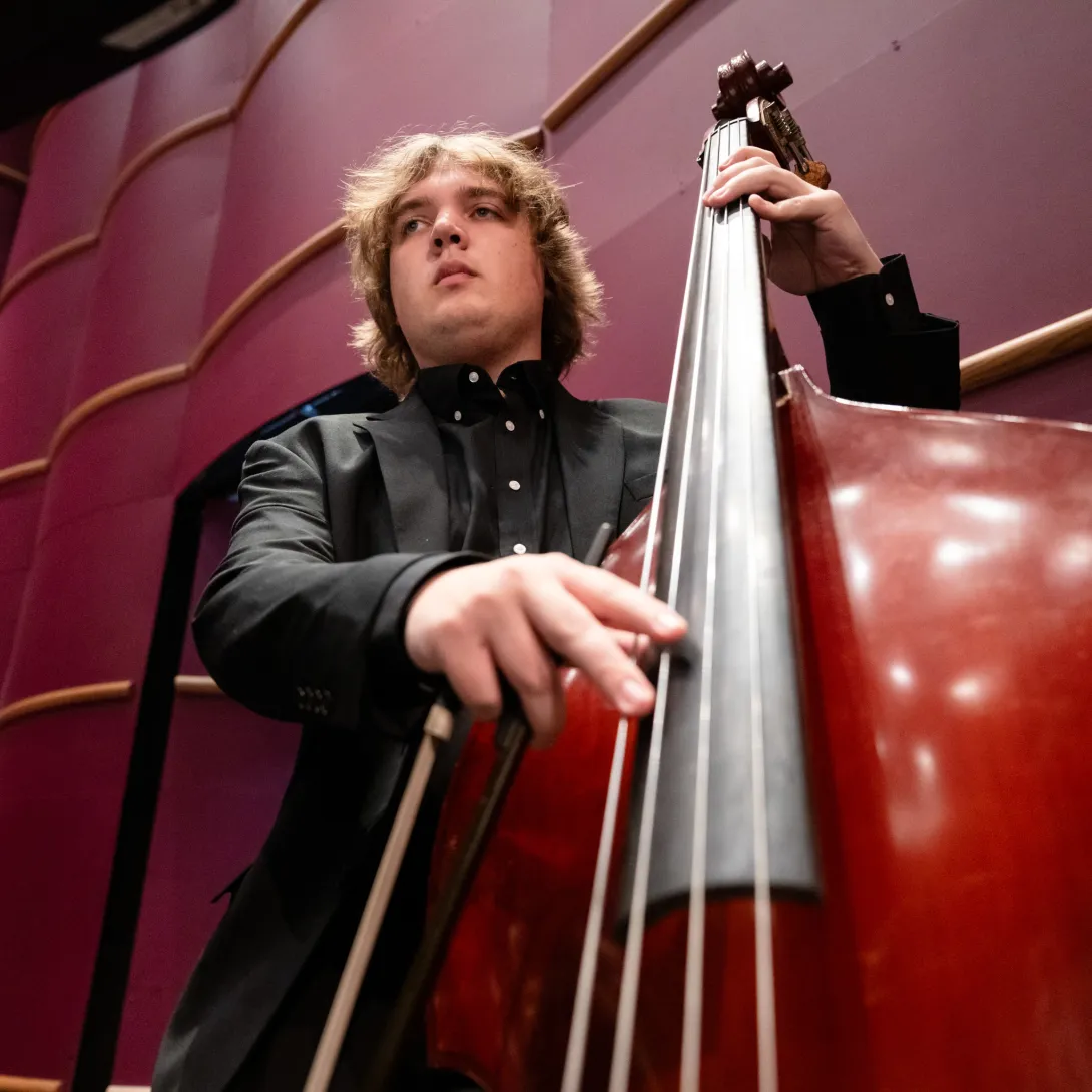 A member of Lehigh Philharmonic Orchestra playing the cello. 